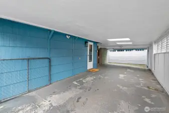 Beyond the carport is a huge 2 car garage.