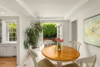 A breakfast nook off the kitchen opens to a beautiful private patio.