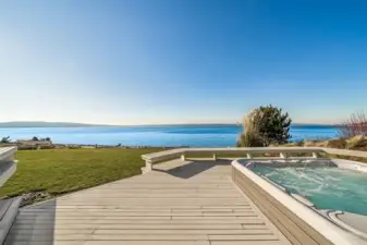 This stunning home offers a picture perfect view from backyard hot tub just off the living room. Sweeping waterfront views that will take your breath away—perfect for soaking in the beauty of each moment, day or night.