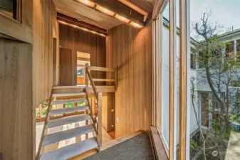 Second stairway from the bonus room leading to all bedrooms upstairs.