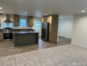 Very open concept looking from living room to kitchen and dining room.