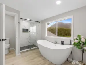 primary bath with luxury soaker tub & gorgeous fully tiled shower