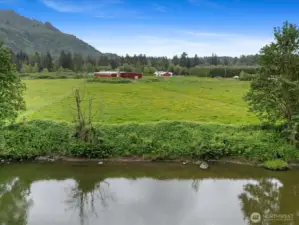 from the river looking back at the property (large barn on left is separate property)