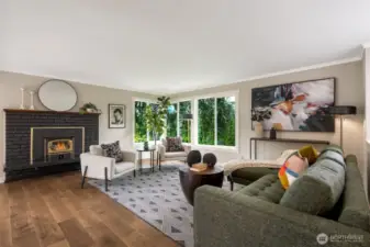 Inviting living room with wood burning fireplace.