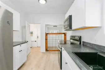 Kitchen (leads to storage and laundry)