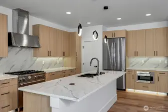Massive kitchen (virtually staged, photo of similar home in separate community)