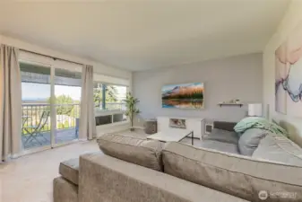 Welcome home to Kirklandaire Condos! The living room opens directly to a private, covered back deck for year-round enjoyment