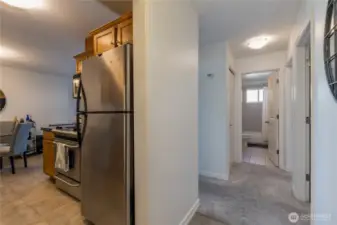 A bright and inviting entry hall separates the private sleeping quarters from the open-concept living spaces.