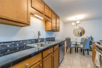 Spacious kitchen with tiled counters and backsplash