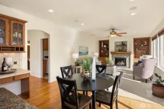 The perfectly sized casual dining area opens to the family room — notice the handy built-in desk tucked just off the kitchen.