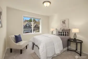 Another of the four upper-level bedrooms — bright, comfortable, and move-in ready.