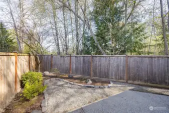 Low maintenance backyard feels incredibly private next to the protected open space behind and next to the home.
