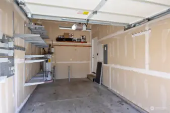 Garage with built-in storage and garage door opener.