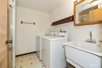 Lower Utility room with half bath, washer & dryer.