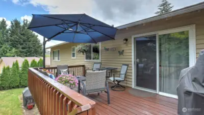 Spacious deck is located right off the dining room for easy access while entertaining all summer long!