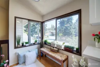 Sunny and bright, this kitchen eating nook is like a sunroom