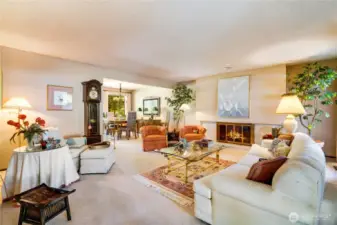 The cozy living and dining room, centered around a warm gas fireplace, offers a welcoming space for relaxing and entertaining.