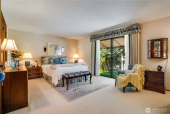 Primary suite with private covered balcony, en-suite bathroom and walk-in closet.