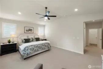 Luxurious primary suite with walk-in closet