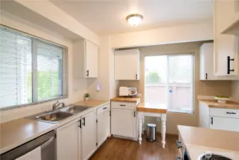 Professionally painted cabinets, black hardware & additional cabinets for more storage.