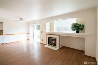 Welcoming living room with gas fireplace and built in tv nook.