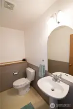 Main floor half bath with water saver toliet.
