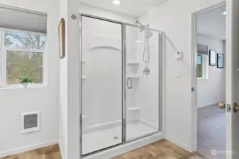 Spacious shower. Window opens for fresh air in bathroom.