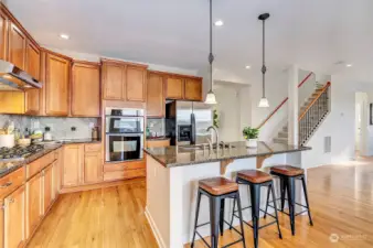 Open-concept kitchen with island with seating area.