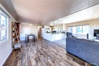 The open living, dining and kitchen area.
