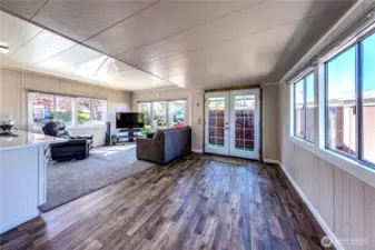 The living room area leading to the front deck.
