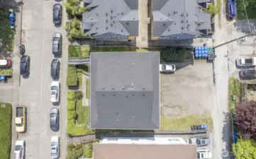 Street-to-alley lot with 2-car garage and 6-8 tandem-style parking spaces.