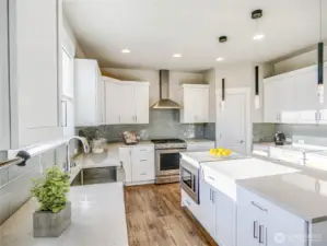 A kitchen to be envied for its generous storage. Beautiful quality cabinetry with soft close cabinets.  Dont Miss walk in pantry.