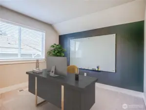 5th Room on upper floor has been set up to accomodate office study as white board and custom paint creates a working wall.