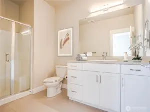 On the entry level as part of the suite of rooms is a 3/4 bath