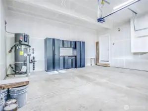 Garage has storage and workshop table. Water heater is the garage. The furnace is in a closet on the entry level under the stairs and the home has central A/C