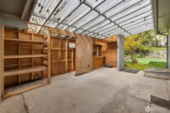 Extra storage space connected to house off of the carport, could be converted to a garage