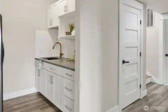 Downstairs kitchenette with full fridge.