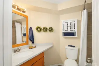 The full bath is centrally located, and directly across from the bedroom. Not shown is a large linen closet in hallway.