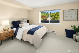 Airy bedroom with 2 large closets, brand new carpet, and beautiful llght. It will fit a king-size bed with room to spare.