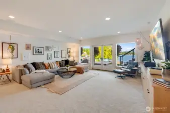 Large downstairs media room with built in surround sound speakers!