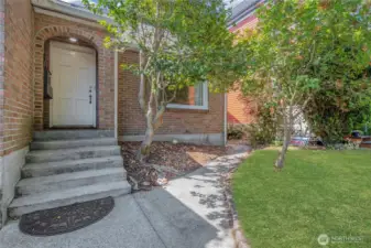 Front door leads to main floor and upper floor units