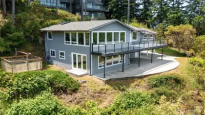 Garden area easily accessible from lower level family room. Park under the deck and access the home through french doors or the side door on the garage.