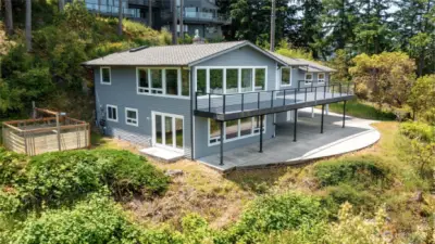 Garden area easily accessible from lower level family room. Park under the deck and access the home through french doors or the side door on the garage.