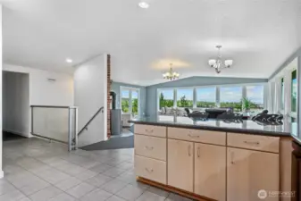 Open Kitchen with a view. Laundry is down hall with half bath. Continue on to Primary Suite and Bonus Room.