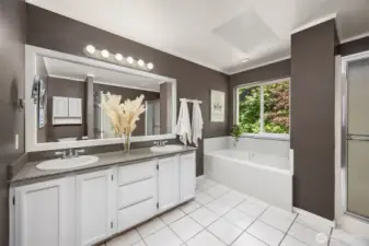 Primary bath is large and luxurious with dual sinks, shower and soaking tub