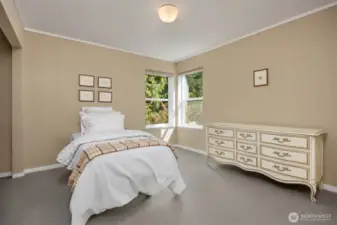 Bedroom #2 has a beautiful view of the backyard.  Walls are covered in lovely grasscloth.