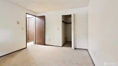Primary Bedroom W/Walk In Closet + Place For Washer and Dryer.