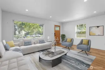 Natural light pours through the large picture window in the living room, brightening every detail. Virtually staged.