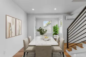 Open-concept flow perfect for both everyday dining and festive gatherings. Virtually staged.