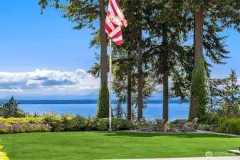 A typical day in the backyard with professionally mainucred lawn.